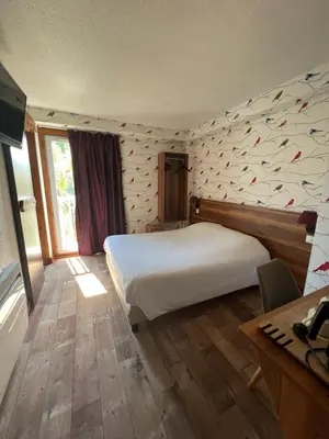 Un ou plusieurs lits dans un hébergement de l'établissement Cit'Hotel Le Montreal
