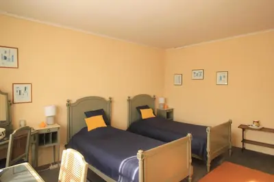 Un ou plusieurs lits dans un hébergement de l'établissement L Ancienne Ferme 17 grand rue