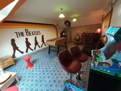 Télévision ou salle de divertissement dans l'établissement Gîte Version 70