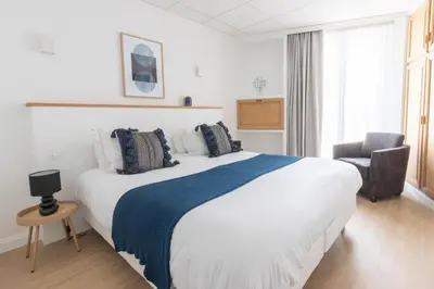 Un ou plusieurs lits dans un hébergement de l'établissement Hôtel Porte Mars - Reims Gare Centre Arena