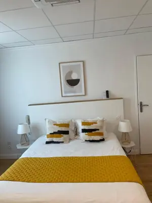 Un ou plusieurs lits dans un hébergement de l'établissement Hôtel Porte Mars - Reims Gare Centre Arena