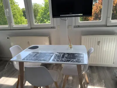 Télévision ou salle de divertissement dans l'établissement Suite au Parc de Fresnoy