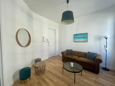 Coin salon dans l'établissement Charming Central Apartment - Reims