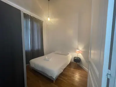 Un ou plusieurs lits dans un hébergement de l'établissement Charming Central Apartment - Reims
