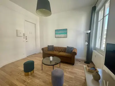 Coin salon dans l'établissement Charming Central Apartment - Reims