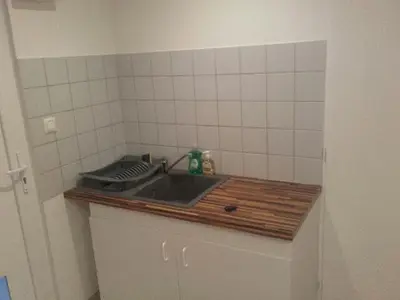Cuisine ou kitchenette dans l'établissement jolie appartement centre de Fismes