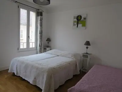 Un ou plusieurs lits dans un hébergement de l'établissement ApartHotel François 1er 16ème