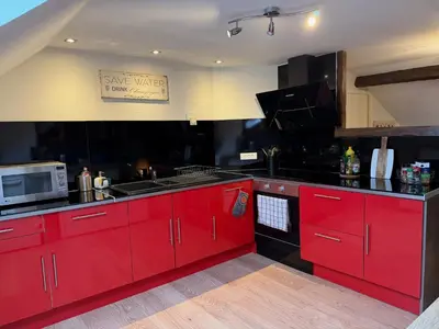 Cuisine ou kitchenette dans l'établissement LE CHAMPENOIS-Appartement central près de l' Avenue de Champagne
