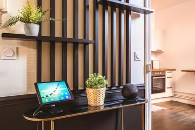 Cuisine ou kitchenette dans l'établissement MM Suites Reims Centre Terasse