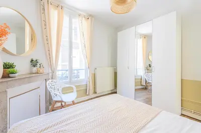 Un ou plusieurs lits dans un hébergement de l'établissement MM Suites Reims Centre Terasse
