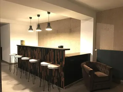 Coin salon dans l'établissement Les Cépages