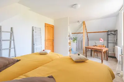Un ou plusieurs lits dans un hébergement de l'établissement Chambres d'Hôtes les Colombes