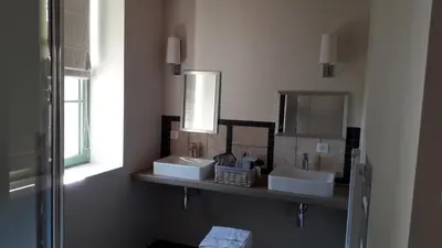 Salle de bains dans l'établissement LE RELAIS
