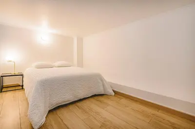 Un ou plusieurs lits dans un hébergement de l'établissement Hyper centre - Hôtel de Ville