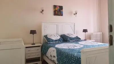 Un ou plusieurs lits dans un hébergement de l'établissement Cosy F3 proche de DisneyLand Paris