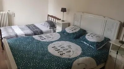 Un ou plusieurs lits dans un hébergement de l'établissement Cosy F3 proche de DisneyLand Paris