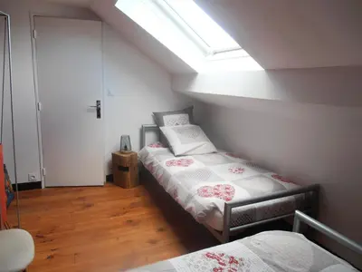 Un ou plusieurs lits dans un hébergement de l'établissement Gîte des Corneilles