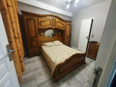 Un ou plusieurs lits dans un hébergement de l'établissement Bel petit appartement
