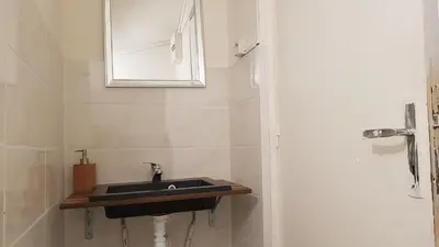 Salle de bains dans l'établissement Cosy F2 proche de DisneyLand Paris