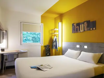 Un ou plusieurs lits dans un hébergement de l'établissement ibis budget Reims Thillois