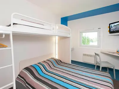 Un ou plusieurs lits dans un hébergement de l'établissement ENZO HOTELS 1er PRIX CHARLEVILLE