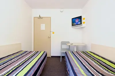Un ou plusieurs lits dans un hébergement de l'établissement ENZO HOTELS 1er PRIX CHARLEVILLE