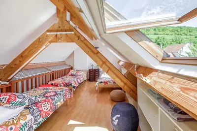 Un ou plusieurs lits dans un hébergement de l'établissement Gîte Leomie - Maison en pierre au pied des vignes - Monthurel