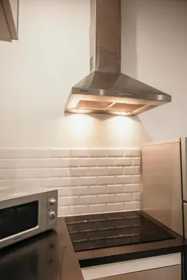 Cuisine ou kitchenette dans l'établissement La suite Delahaye
