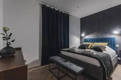 Un ou plusieurs lits dans un hébergement de l'établissement Art Déco Gare & Spa