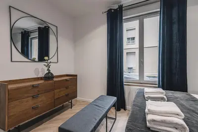 Un ou plusieurs lits dans un hébergement de l'établissement Art Déco Gare & Spa