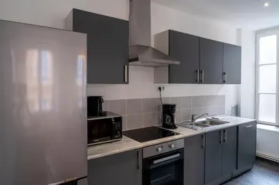 Cuisine ou kitchenette dans l'établissement Suite Ophélie