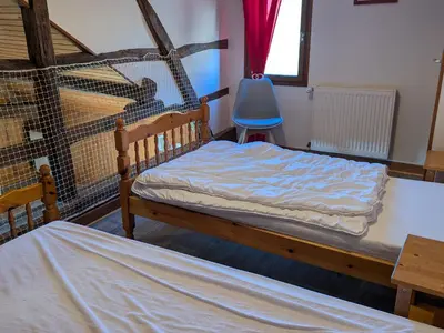 Un ou plusieurs lits dans un hébergement de l'établissement Charmant gîte rénové en 2015, au cœur de l'Argonne, entre Verdun et Châlons-en-Champagne - FR-1-585-21