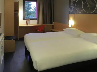 Un ou plusieurs lits dans un hébergement de l'établissement ibis Soissons