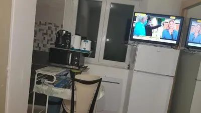 Cuisine ou kitchenette dans l'établissement MAGNIFIQUE STUDIO