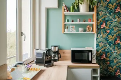 Cuisine ou kitchenette dans l'établissement Magnifique duplex 3 chambres proche centre-ville et gare Chemin du Barrage