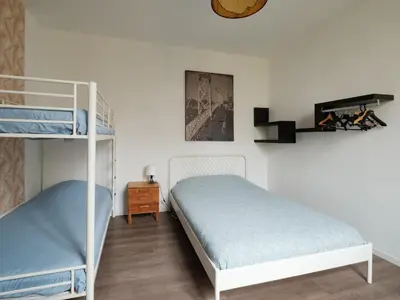 Un ou plusieurs lits dans un hébergement de l'établissement Magnifique duplex 3 chambres proche centre-ville et gare Chemin du Barrage