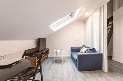 Coin salon dans l'établissement Le Coquet Logement Climatisé face à la Cathédrale - 3G