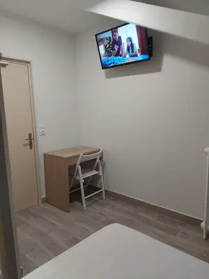 Télévision ou salle de divertissement dans l'établissement Ardenn'Hotel
