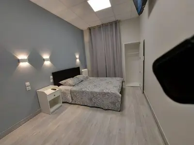 Un ou plusieurs lits dans un hébergement de l'établissement Ardenn'Hotel