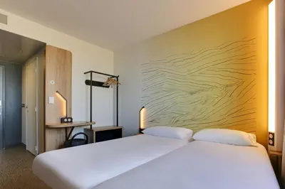 Un ou plusieurs lits dans un hébergement de l'établissement B&B HOTEL Reims Croix Blandin