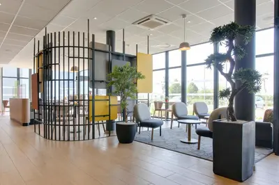 Coin salon dans l'établissement B&B HOTEL Reims Croix Blandin