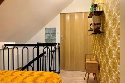 Un ou plusieurs lits dans un hébergement de l'établissement Appartement Vintage avec vue sur le château