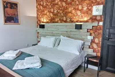 Un ou plusieurs lits dans un hébergement de l'établissement Les Appartements Fénelon