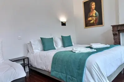 Un ou plusieurs lits dans un hébergement de l'établissement Les Appartements Fénelon