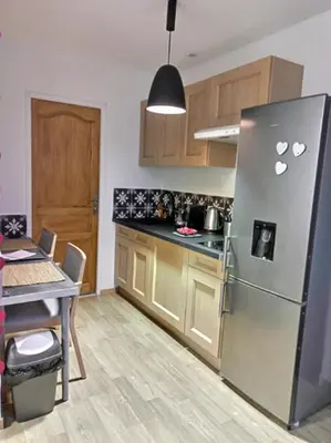 Cuisine ou kitchenette dans l'établissement Les Suites Fénelon