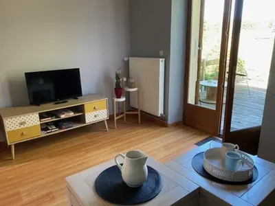 Télévision ou salle de divertissement dans l'établissement Le moulin Bertrand