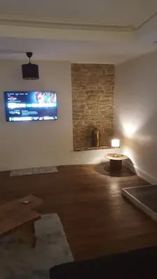 Télévision ou salle de divertissement dans l'établissement Appartement spacieux et atypique