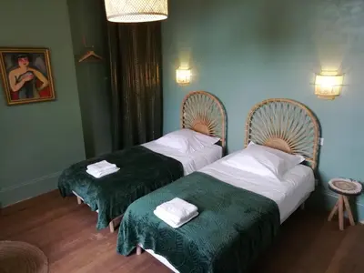 Un ou plusieurs lits dans un hébergement de l'établissement VILLA HENRI