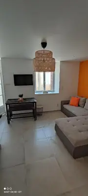 Coin salon dans l'établissement Les Suites du Relais