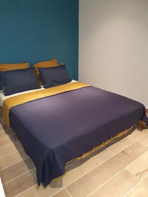 Un ou plusieurs lits dans un hébergement de l'établissement Les Suites du Relais